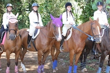 4-H participants on horseback